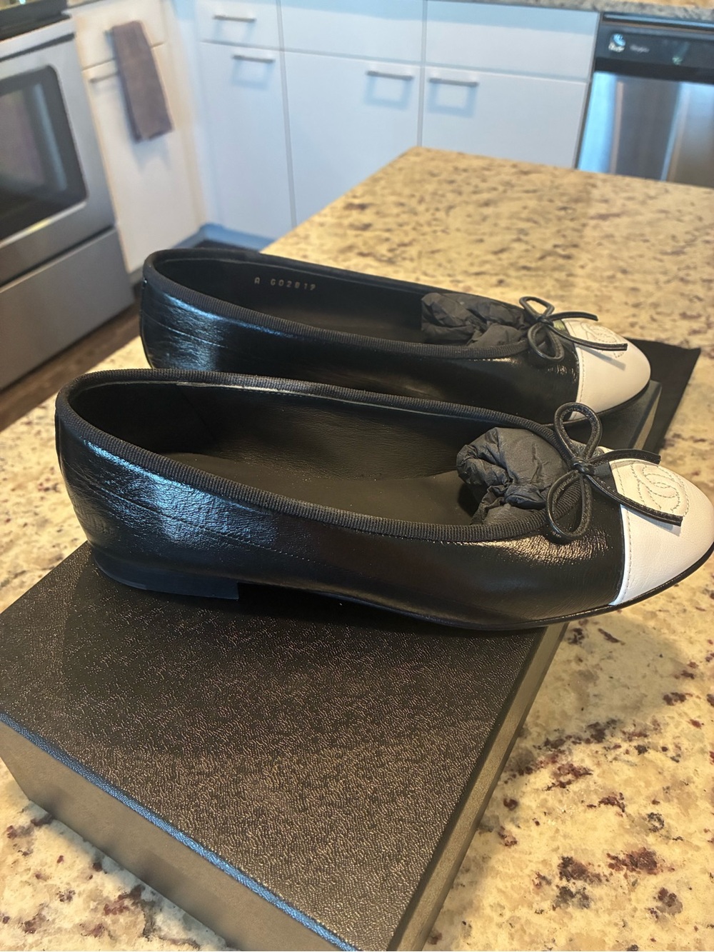 CHANEL Black Leather Ballet Flats with White Cap Toe and Bow - Picture 6 of 10